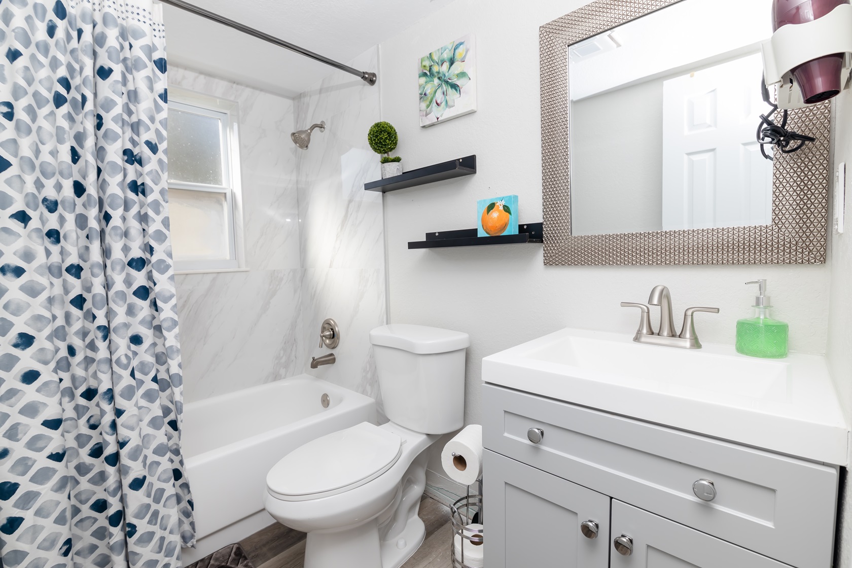 real estate photography of a bathroom with an orange canva to represent tampa bay florida